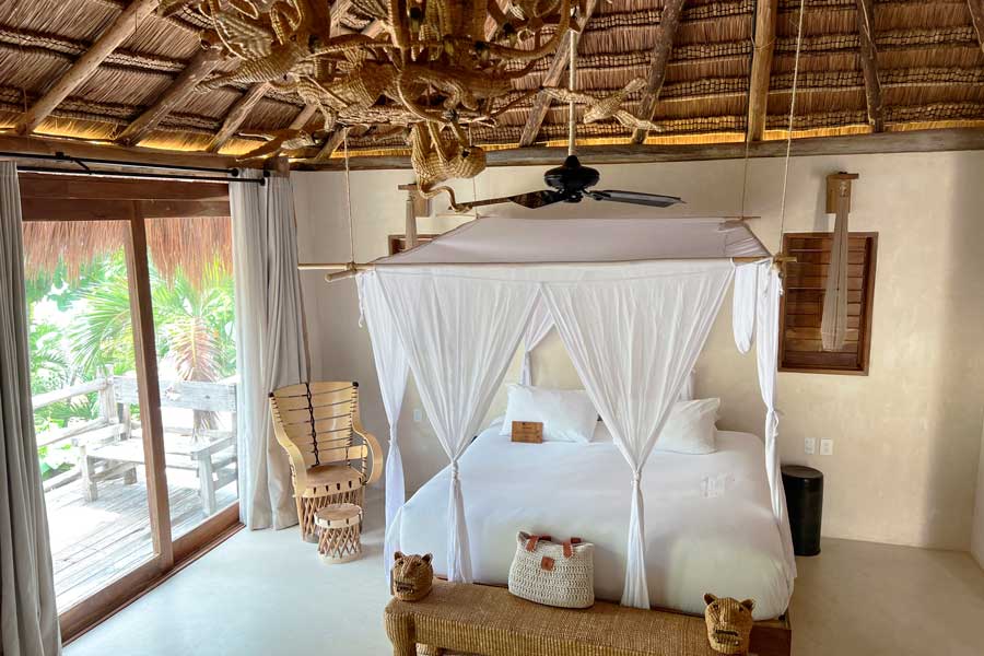 View of a bed inside a room in La Valise Tulum