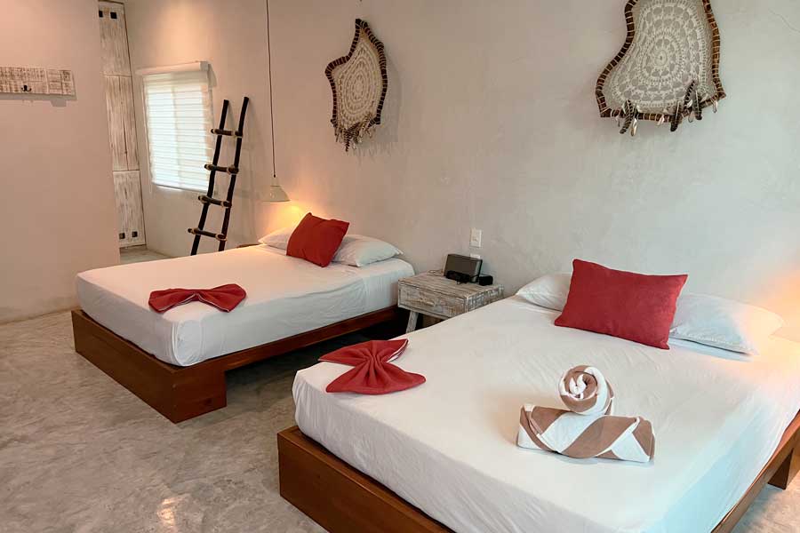 Two beds on a room in Villas H20