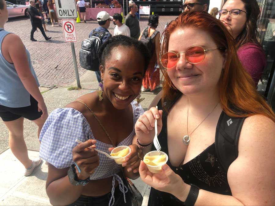 The author with her friend enjoying a sample from Beecher’s Handmade Cheese