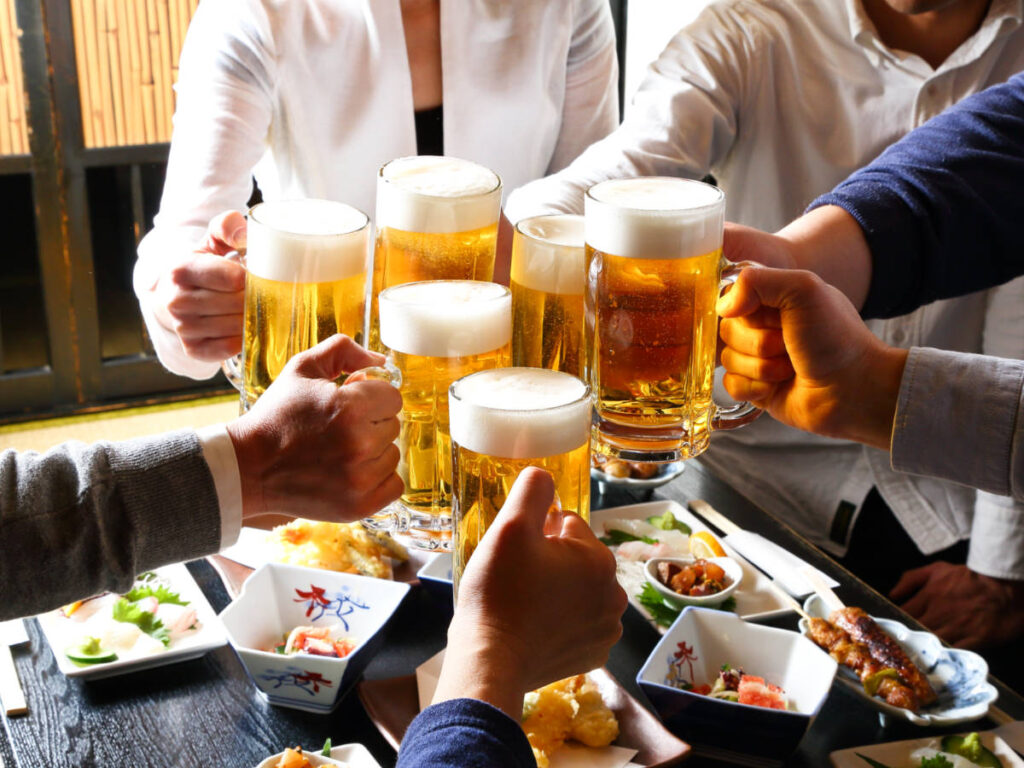 A group of people doing a beer toast