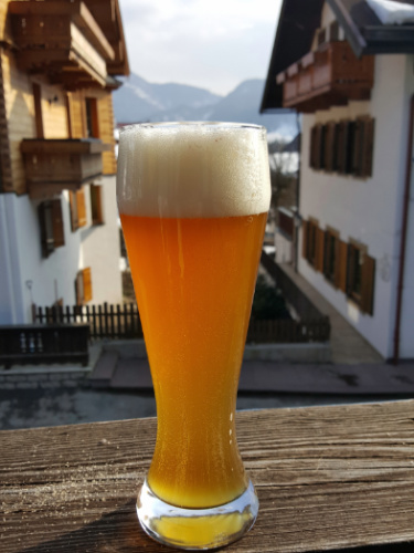 A glass of German beer on a balcony