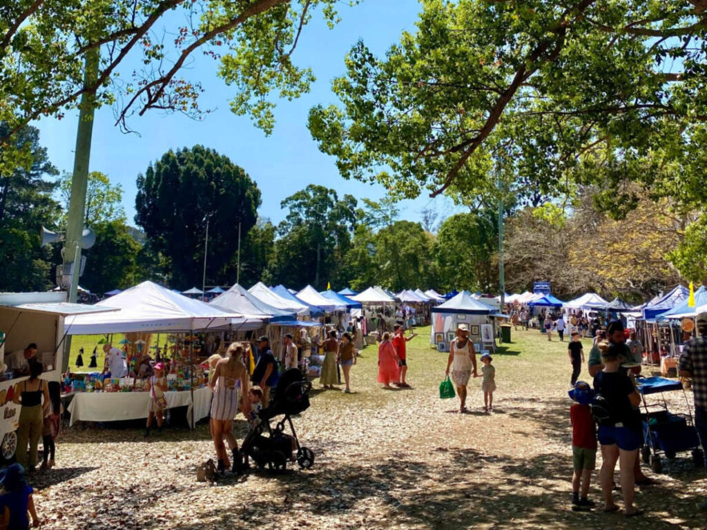 Groups of people exploring the stalls at Bellingen’s monthly market