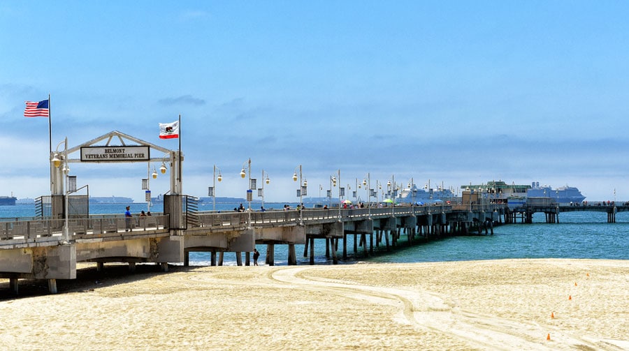 View of a pier in Belmont Shore with the clear blue sky above it