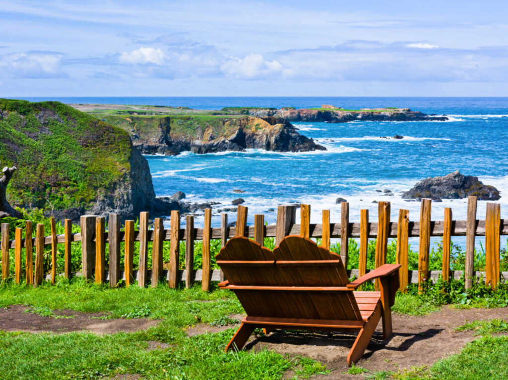A bench chair facing the stunning views of the coast from Mendocino