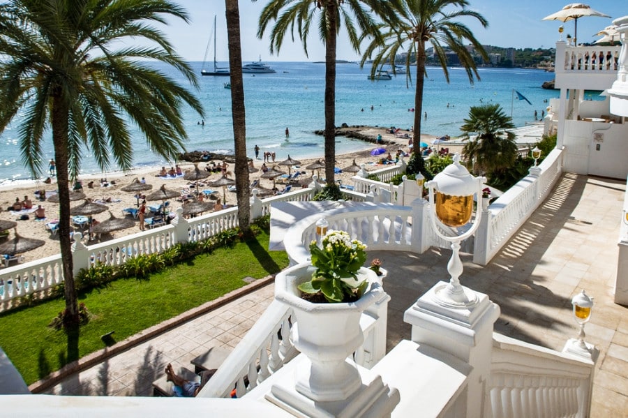 Tourists enjoying the sun on the coastline view from Nixe Palace Hotel