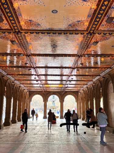 People walking through Bethesda Terrace