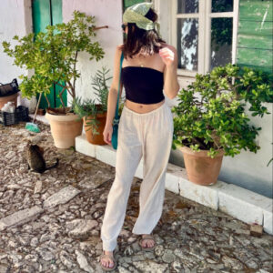 The author Betty Hurd, posing for a photo while wearing a linen pants in Greece