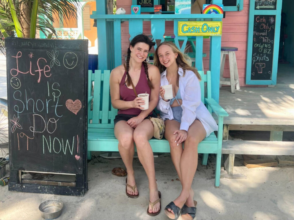 The author Betty Hurd and her friend drinking in front of a local store