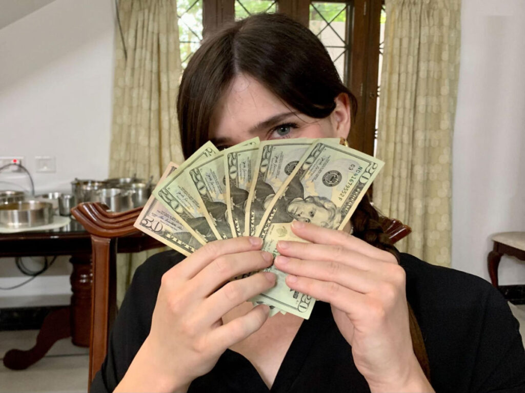 Betty holding some dollars