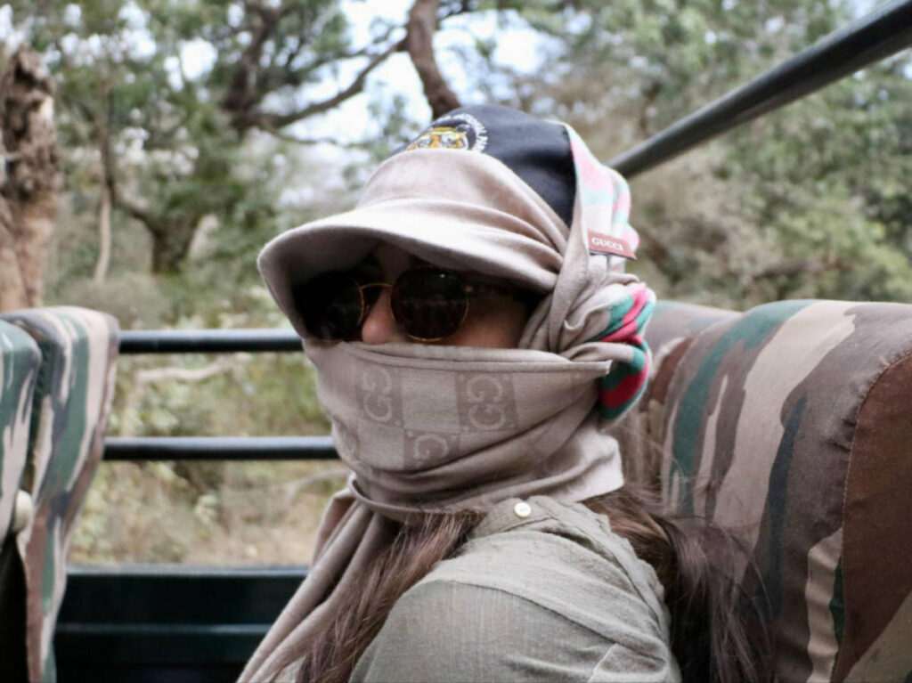 Betty covering her face with the scarf