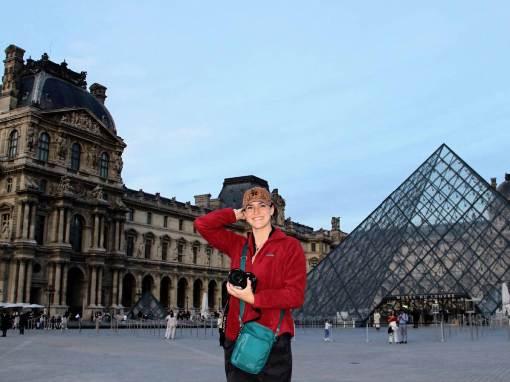 Travel Lemming writer Betty Hurd in front of the Louvre