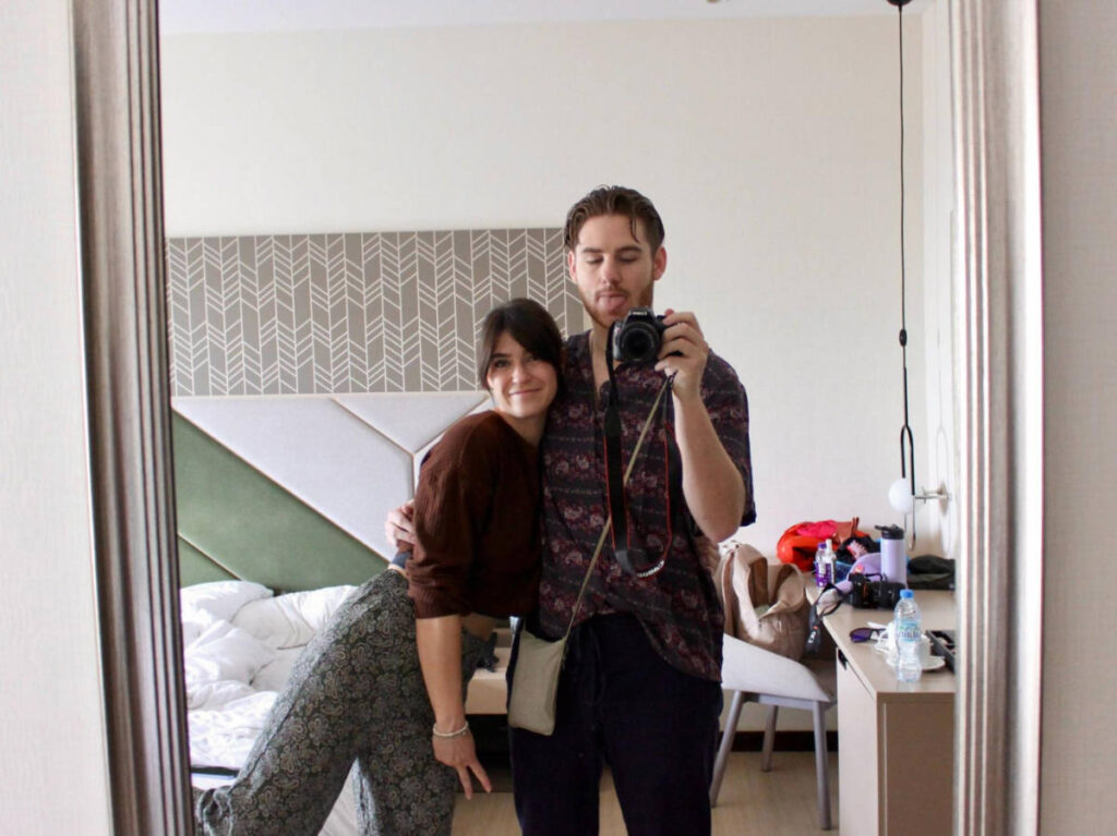 The author Betty Hurd with her partner smiling for a mirror selfie