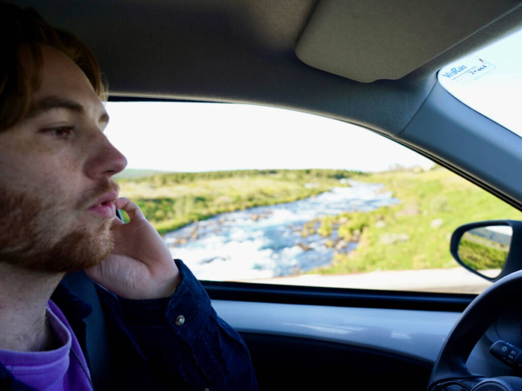 Closeup look of the author's boyfriend driving the rented car