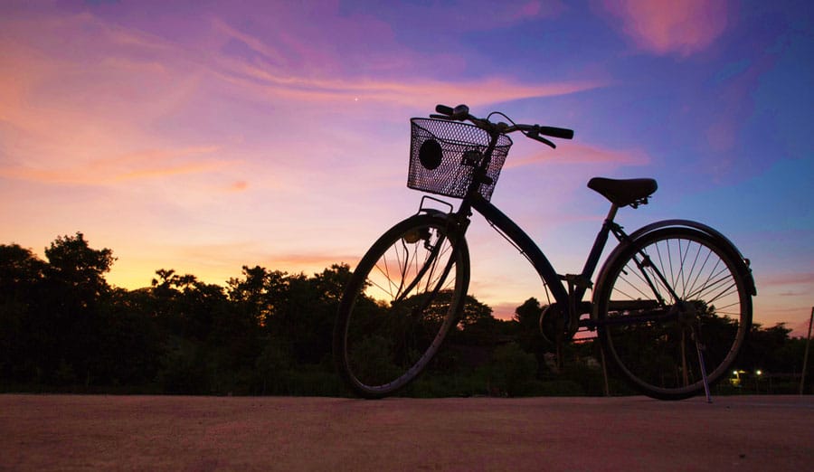 A bicycle and the colorful sky during sunset in Vieques