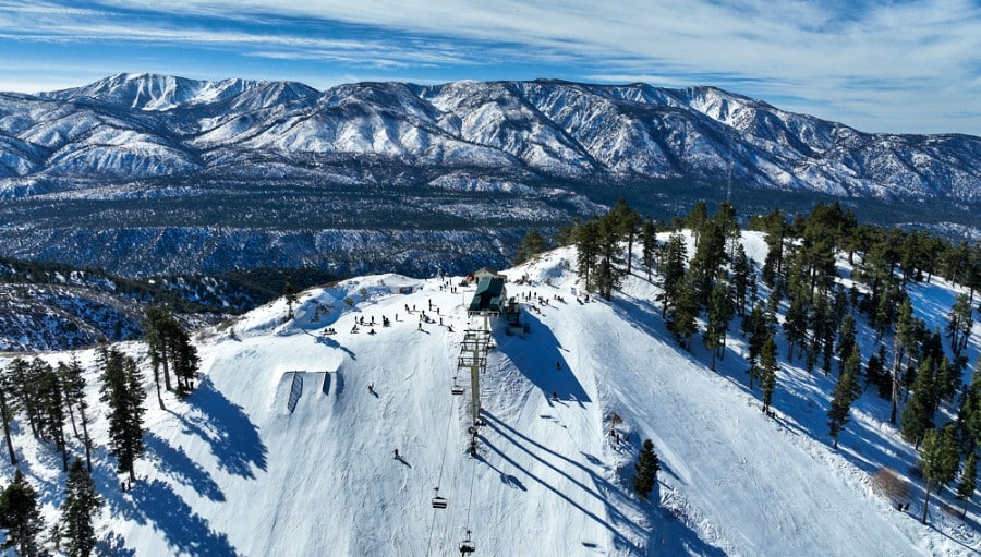 Aerial view of the beautiful landscape of the snow covered Big Bear mountain resort.