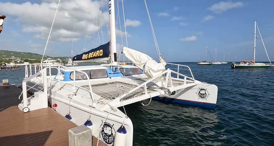 The boat of Big Beards on a dock in Buck Island