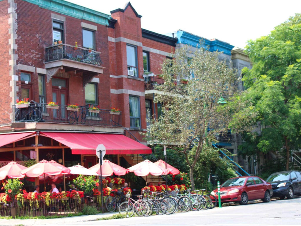 Bikes and cars parked outside a cafe in Montreal