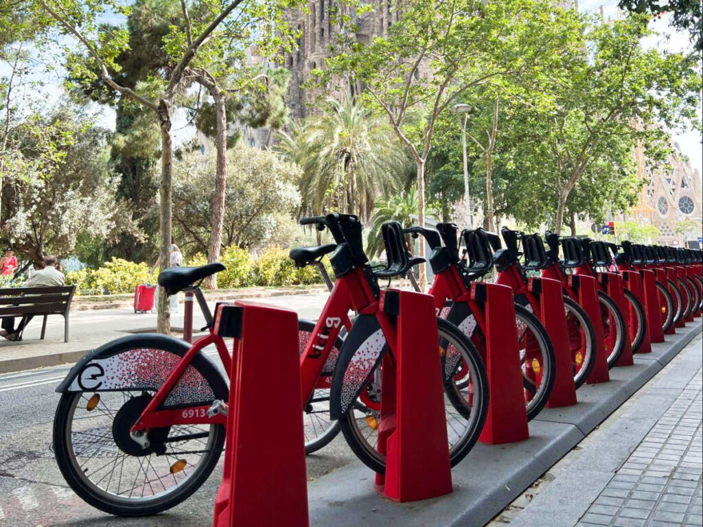 View of the lined bikes at the biking station in front of Sagrada Familia