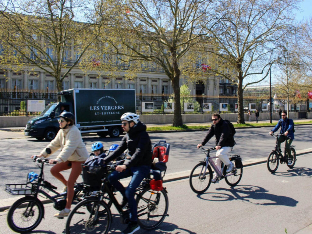 A family biking on the pathways by the Seine