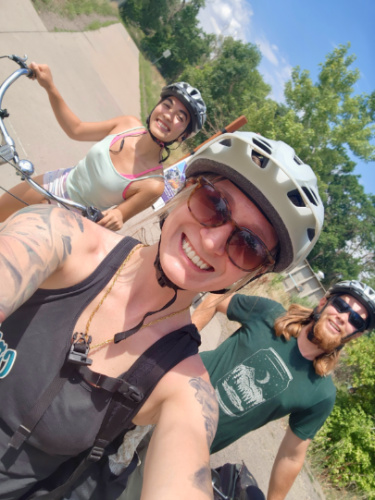 Editor Abigail Bliss and her friends biking on Clear Creek Trail