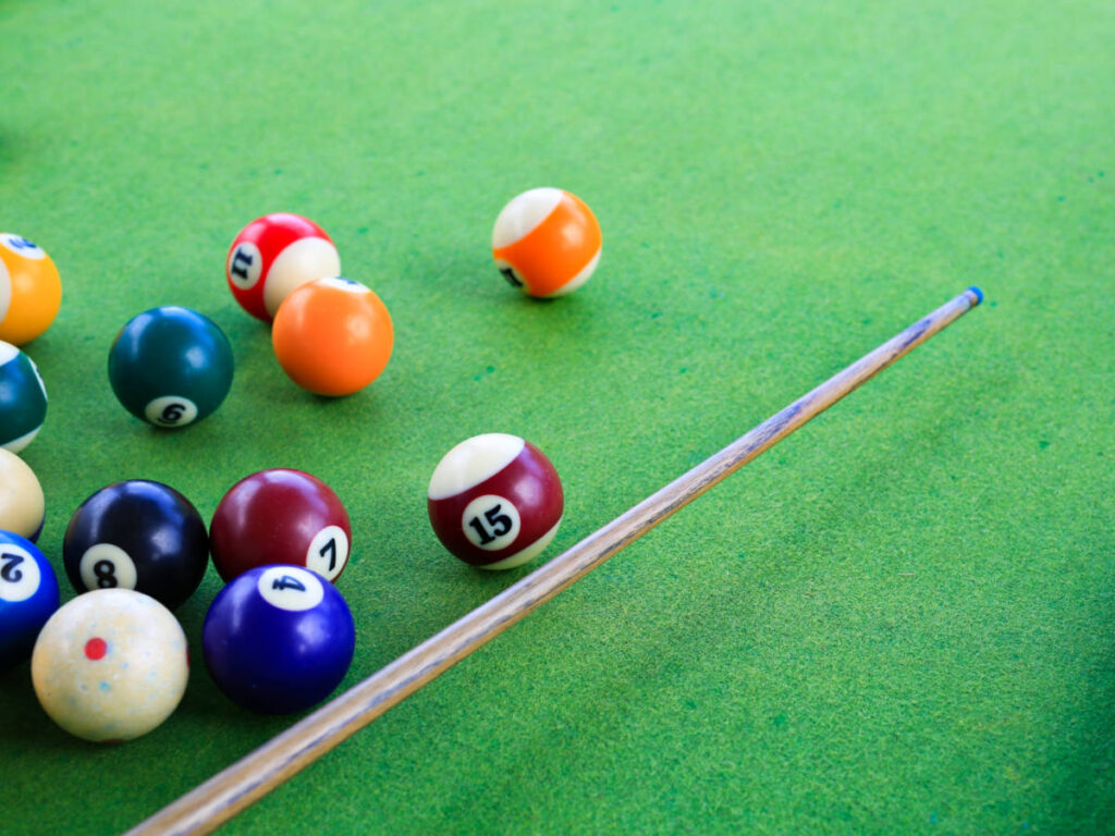 View of the pool table with the billiard balls