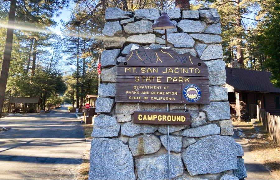 A close-up look at the small stone wall signage of San Jacinto State Park Campground