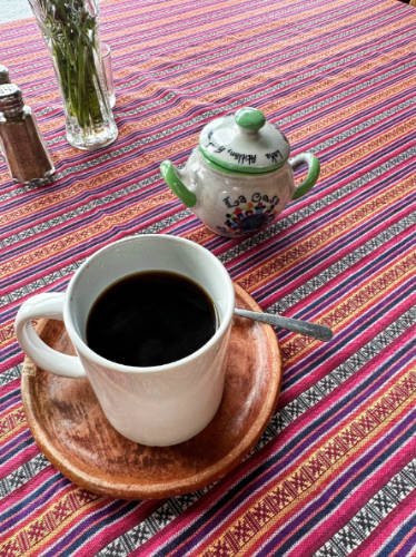 A cup of black coffee served in La Casa del Mundo