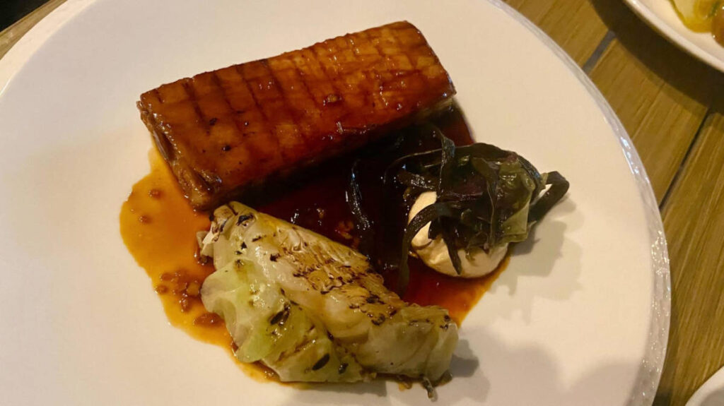 A plate of pork belly served at Blanchette French Bistro in Soho