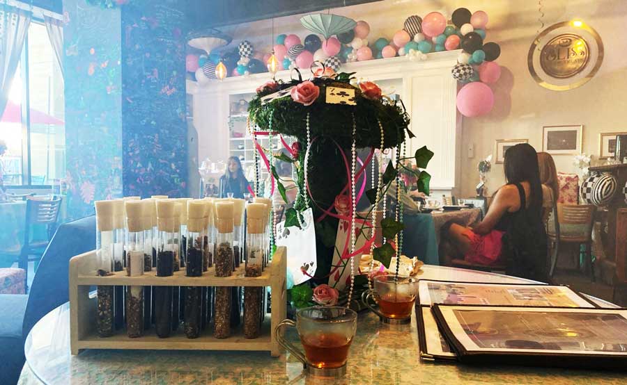 Decorations and people inside Bliss Tea & Treats in Oceanside