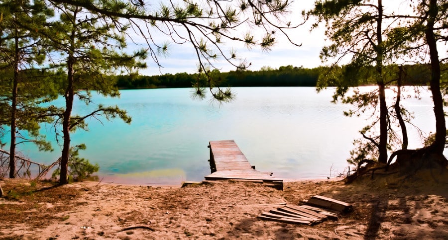 Stunning view of lake Blue Hole with a small boardwalk in Hammonton, NJ