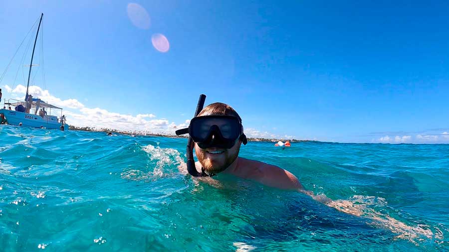 The author snorkeling on the blue water of the Caribbean