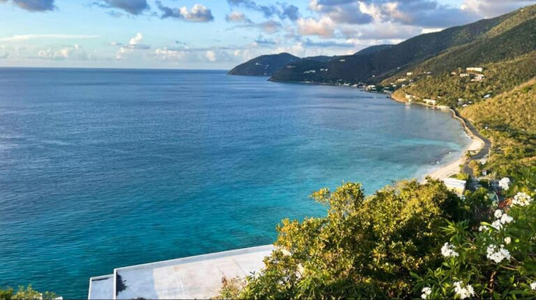 Overlooking view of the deep blue water surrounded with the lush island