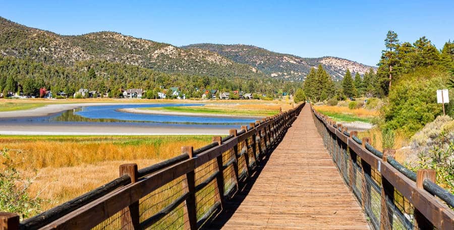 Panoramic view of the landscape and boardwalk at Big Bear Lake