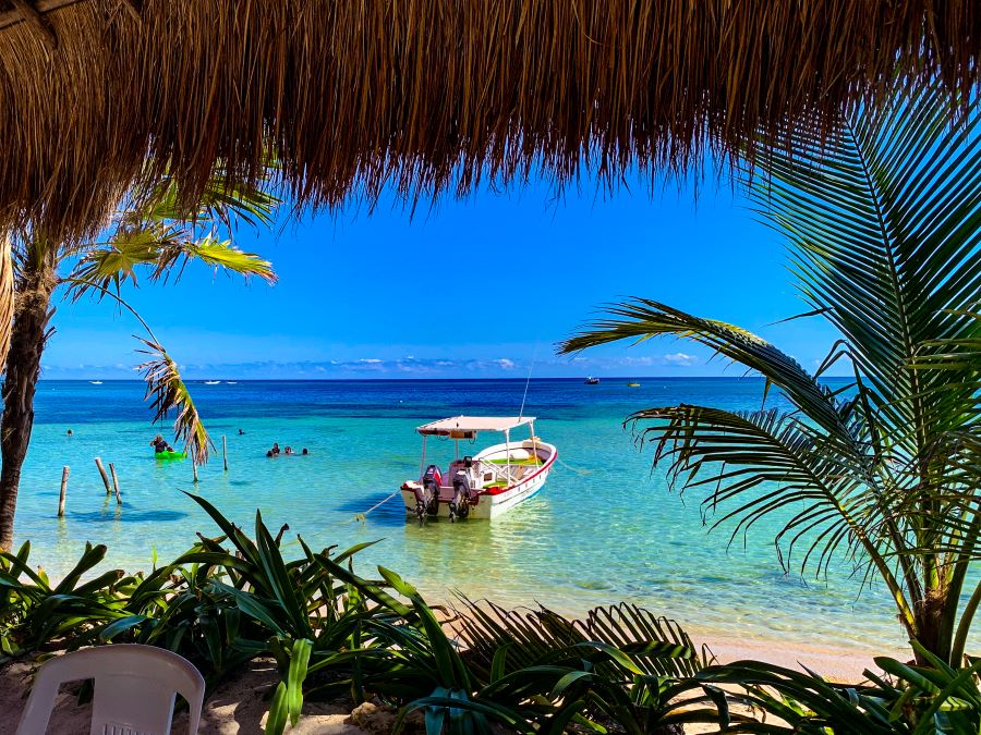 Clear blue sky over a boat in Mahahual