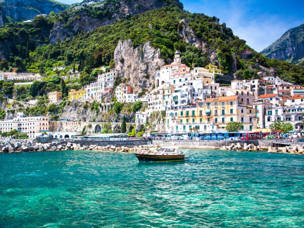 Picturesque view of a boat in front of the buildings in Positano