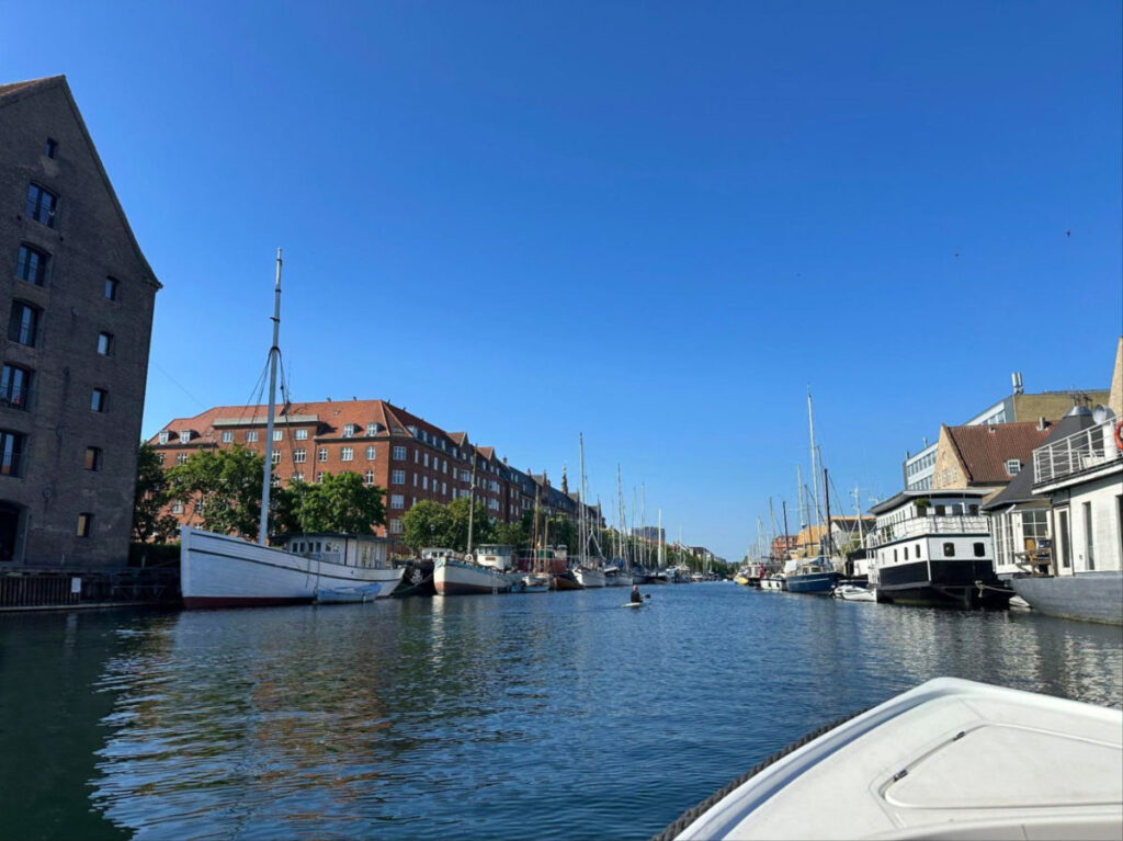 Boating around Christianshavn and Boats docked in a canal near buildings
