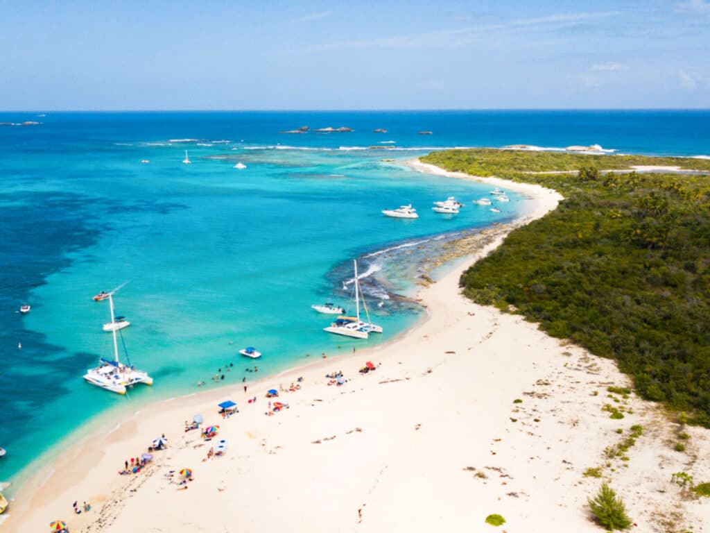 Aerial view of the docket boats and catamarans at the lush island of Icacos