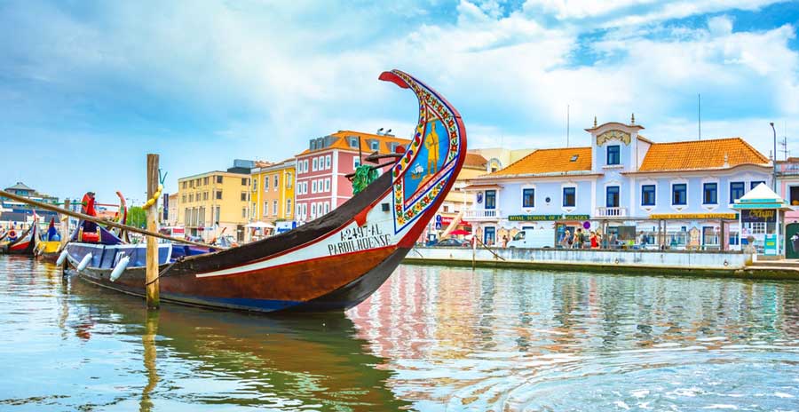 A colorful traditional boat on a canal in Aveiro