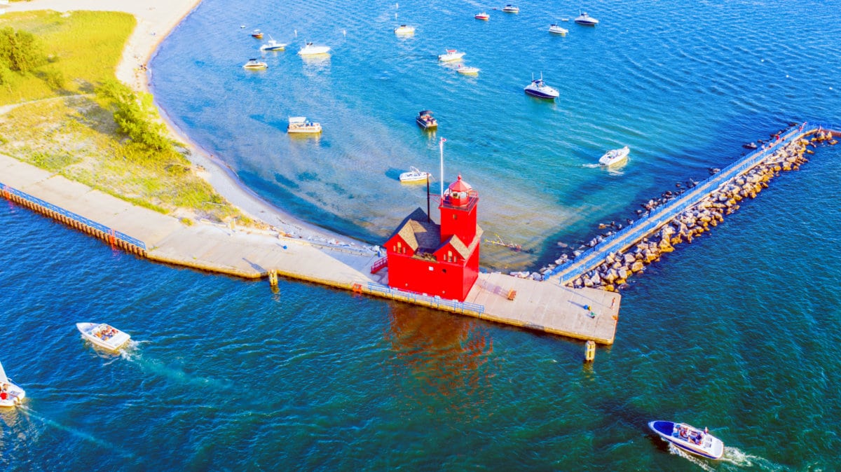 Aerial view of the boats sailing away the Holland Harbor