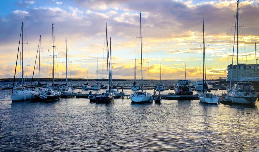 View of boats in PEI and the colorful sunset