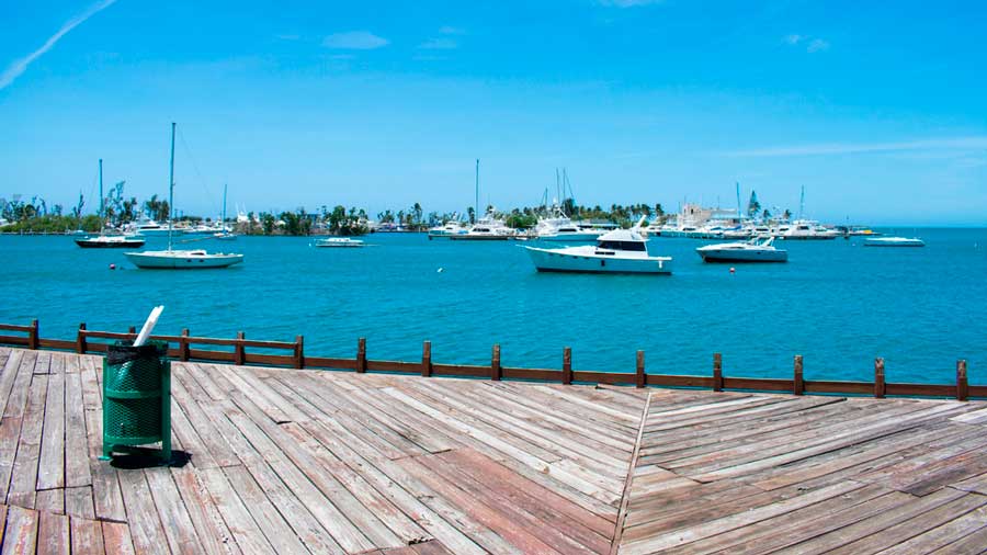 View of boats on the Flamenco Beach and the clear blue sky over it