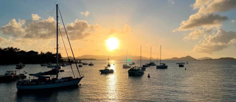 Sunset view of boat in St John against the ocean