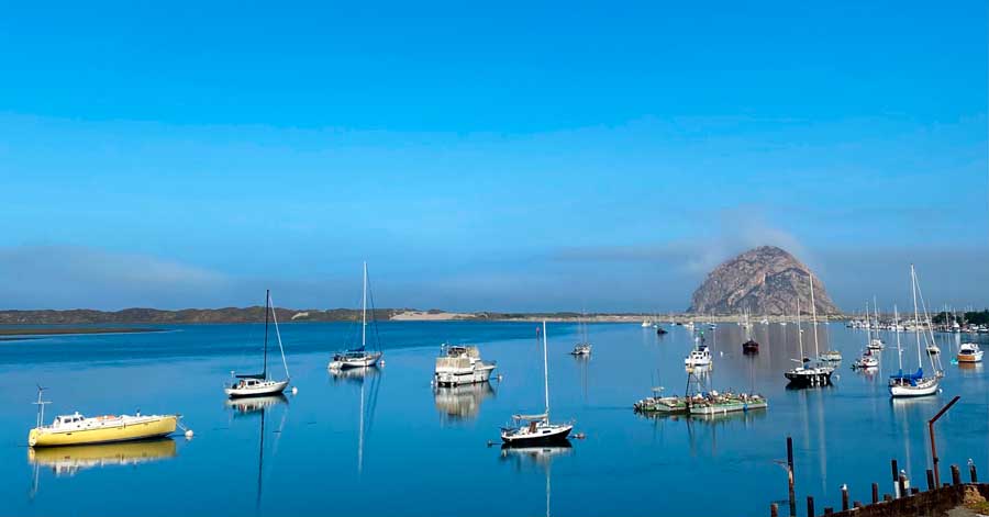 View of boats in Morro Bay and the Morro Rock from afar