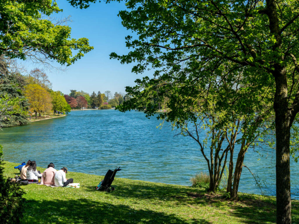 Parisians relaxing on the lower lake in the Bois de Boulogne on a sunny day
