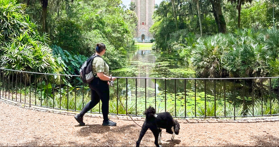 The author (Marina Martinelli) and her dog Athena explore the Bok Tower Gardens in Lake Wales