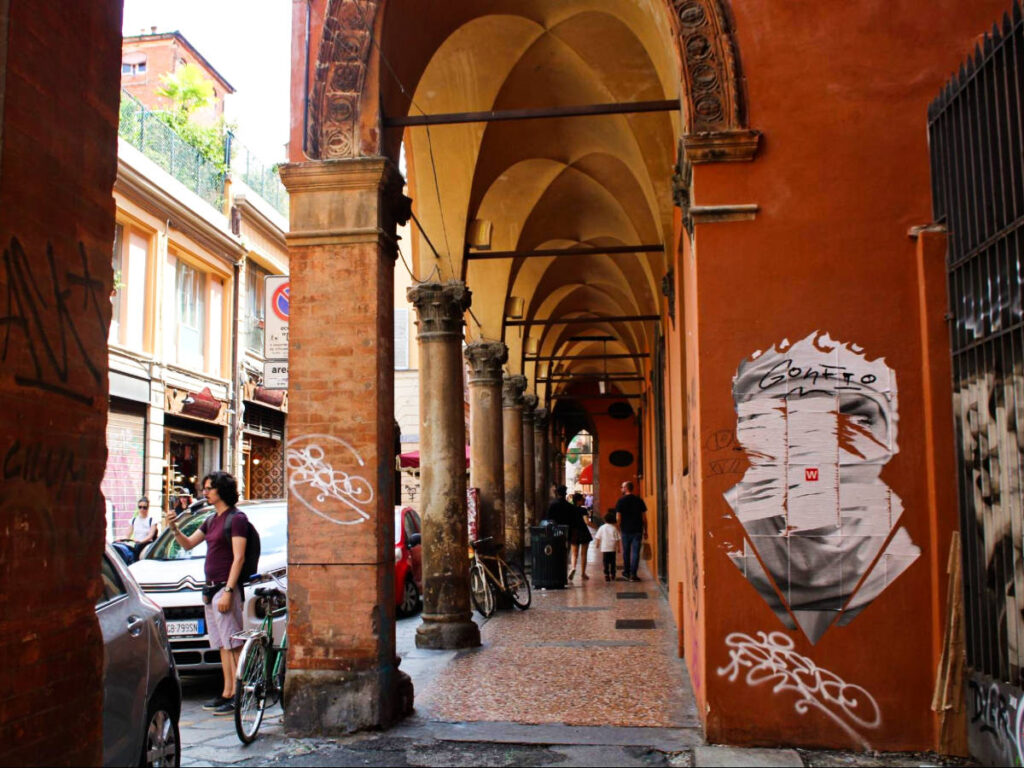 View of the graffitis and beautiful arches around the city of Bologna