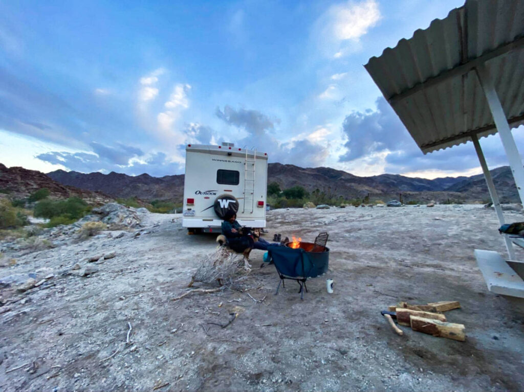 The author McKenna Mobley, having a bonfire  at the campground near Death Valley