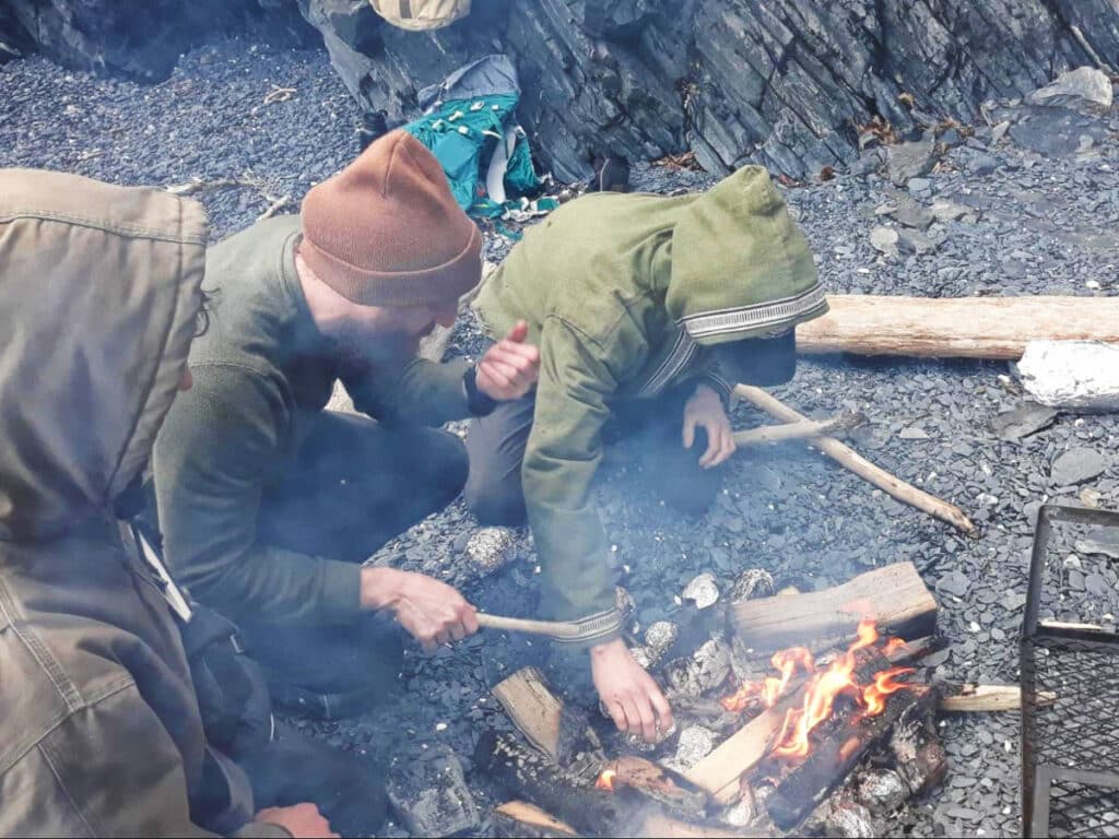 A group of man preparing a bonfire