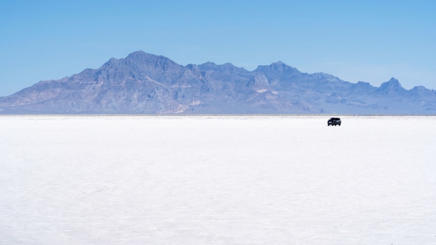 A car parked in the middle of Bonneville Salt Flats