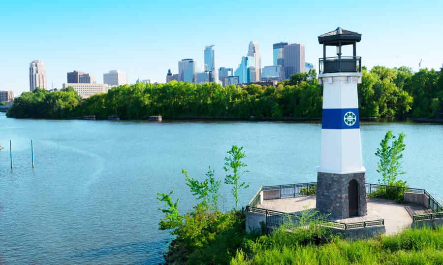 The lighthouse in Boom Island Park and the clear blue sky above the skyscrapers